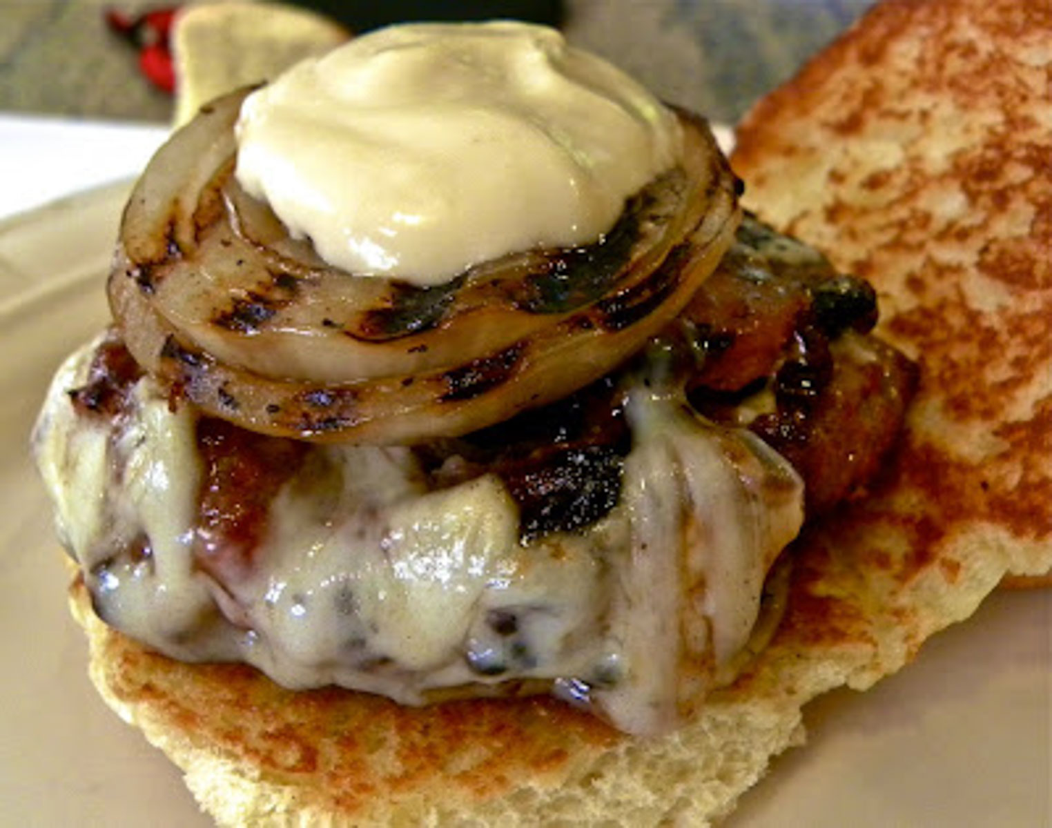 Grilled hawaiian hamburger with grilled sweet onion and wasabi may