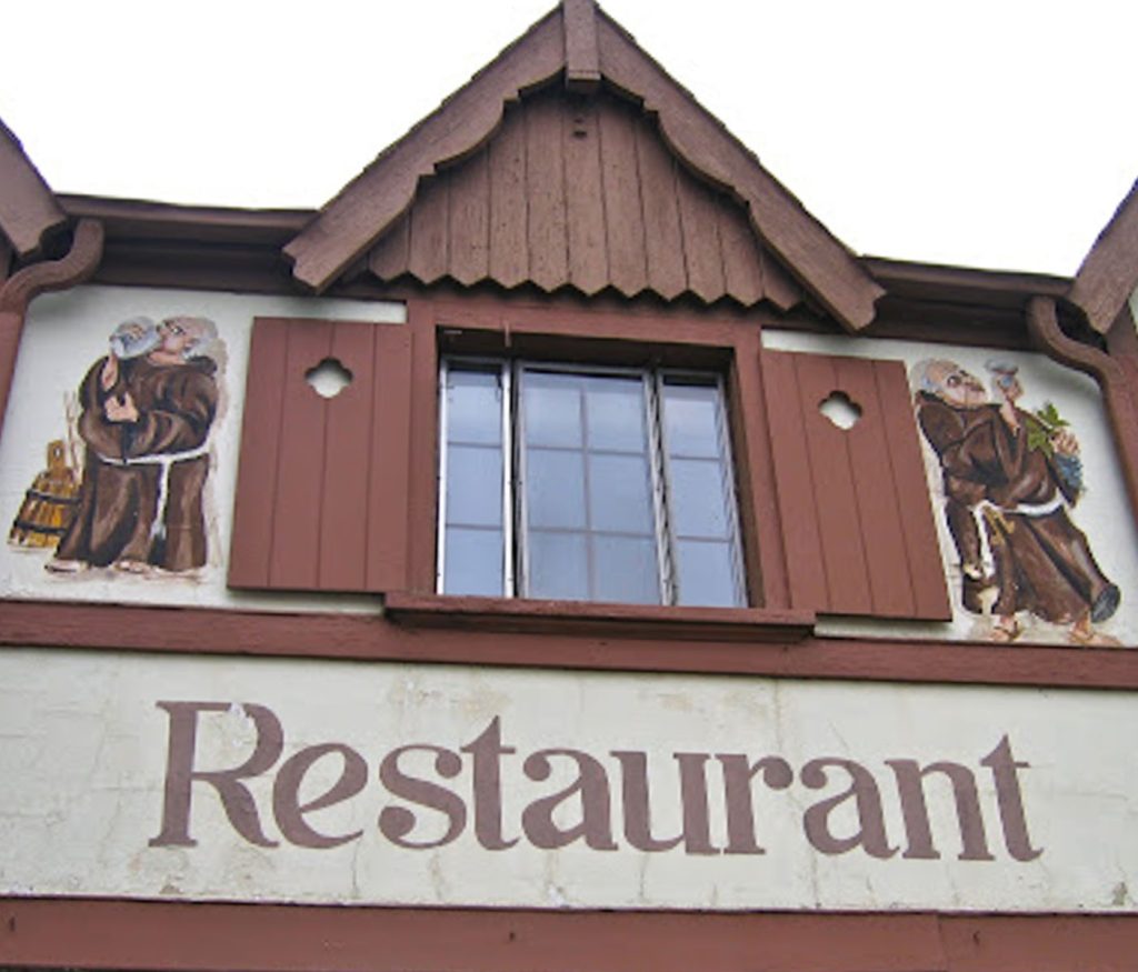 mural on the wall of the schnitzelbank restaurant in grand rapids michigan of two monks drinking