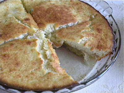 baked pancake in a pie plate with one slice take out