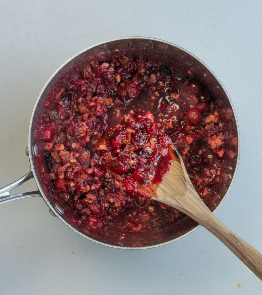 cranberry relish cooking in a medium sized saucepan