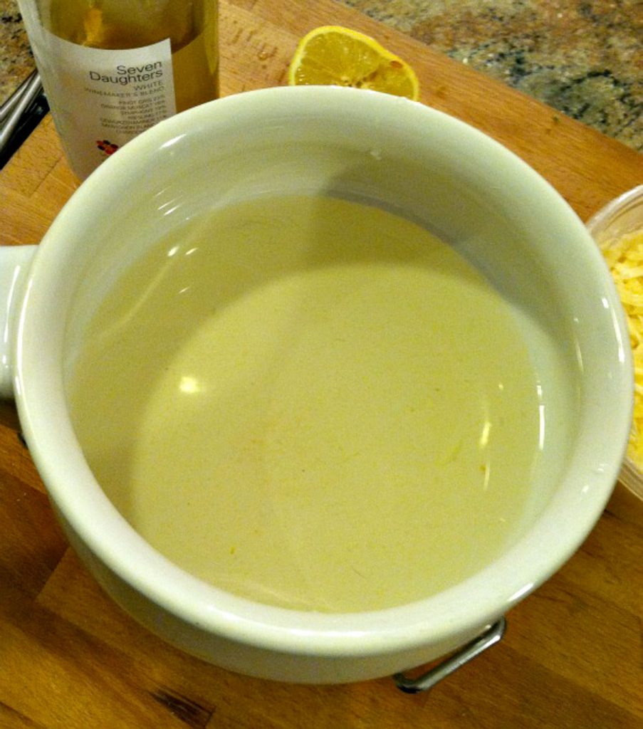 fondue process, adding wine to the pot