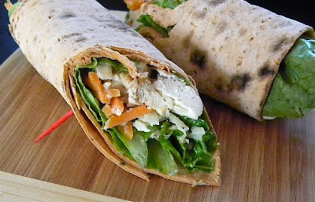 chicken caesar wrap: chicken lettuce and carrot wrapped up in a tortilla shell.