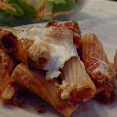 scoop of mostaccioli pasta on a white plate