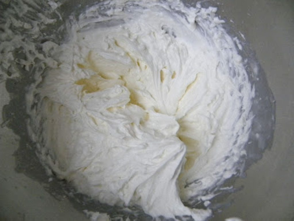 cream cheese layer of Lush Dessert in a mixing bowl