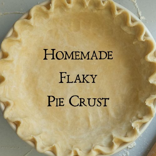 picture of a pie crust in a pie dish on a lightly floured gray countertop