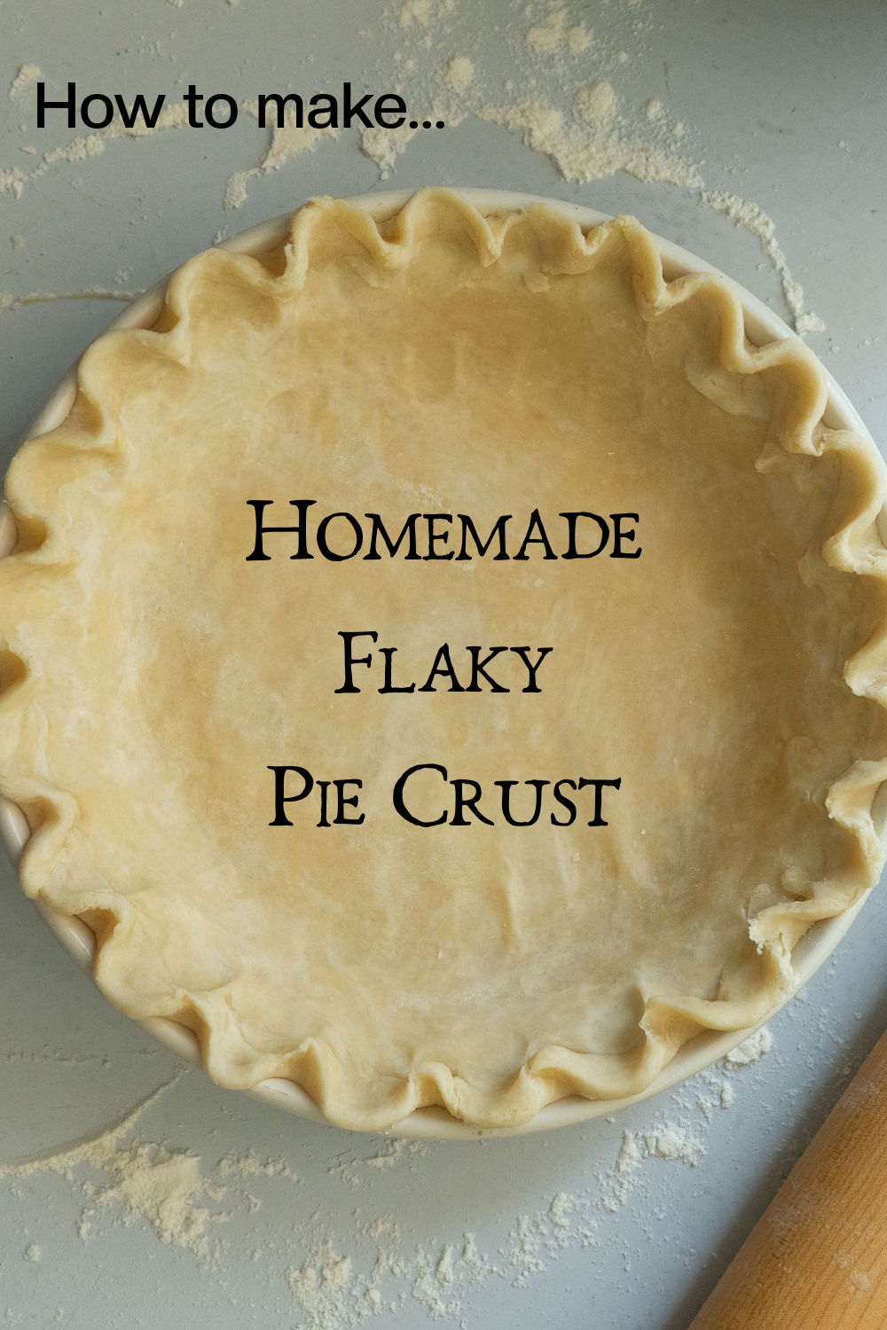 picture of a pie crust in a pie dish on a lightly floured gray countertop