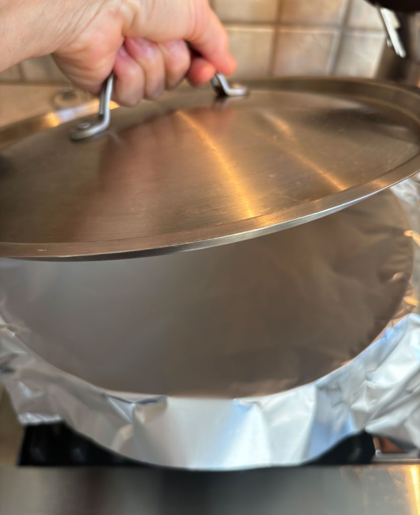 cover soup pot with aluminum foil, and then place lid on top of the pot