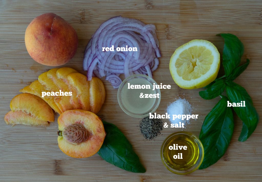ingredients for peach basil salad layed out and labeled on a wood cutting board