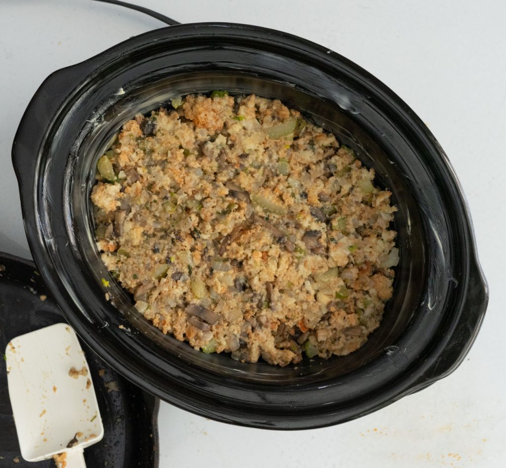 crockpot full of stuffing mixture before cooking