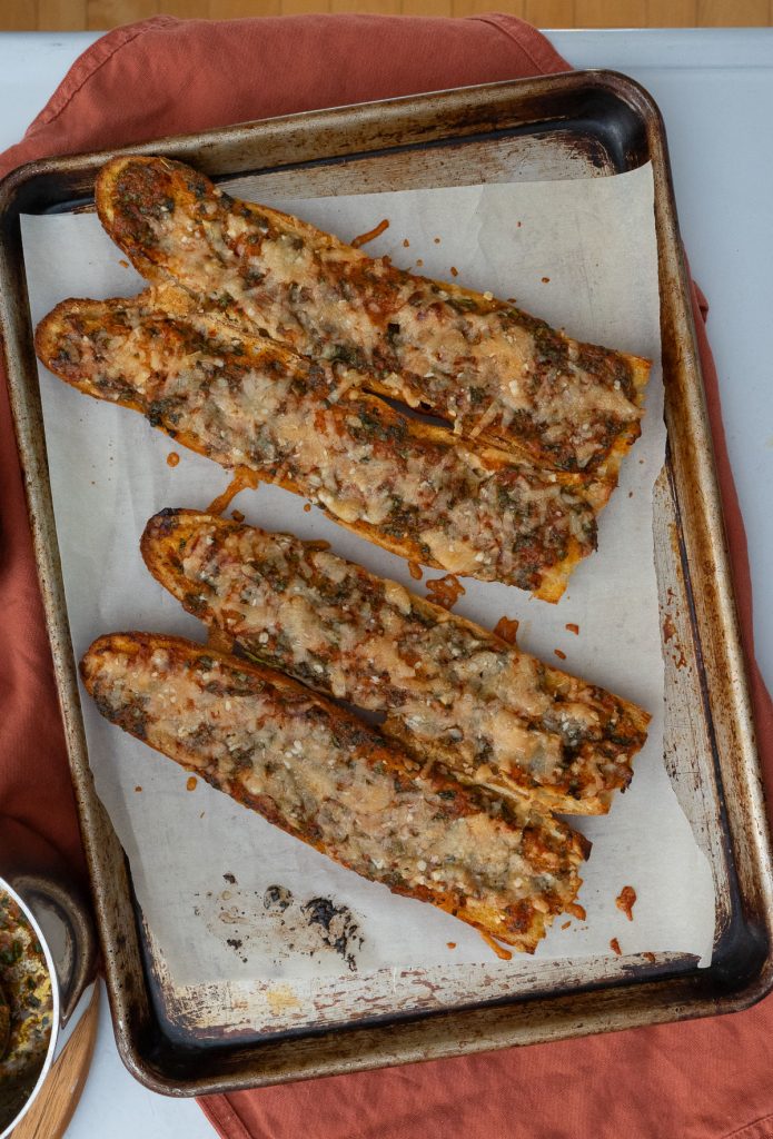 four baguette of Cilantro chili bread on a sheet pan 