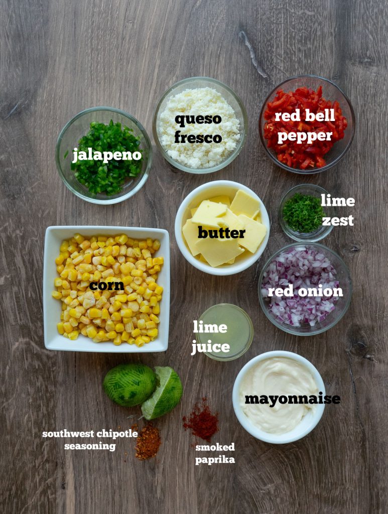 mexican street corn casserole ingredients on a wood countertop
