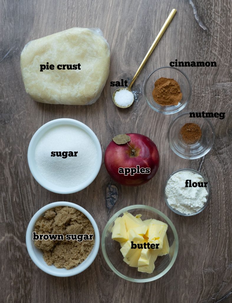 ingredients for dutch apple pie on a wood cutting board