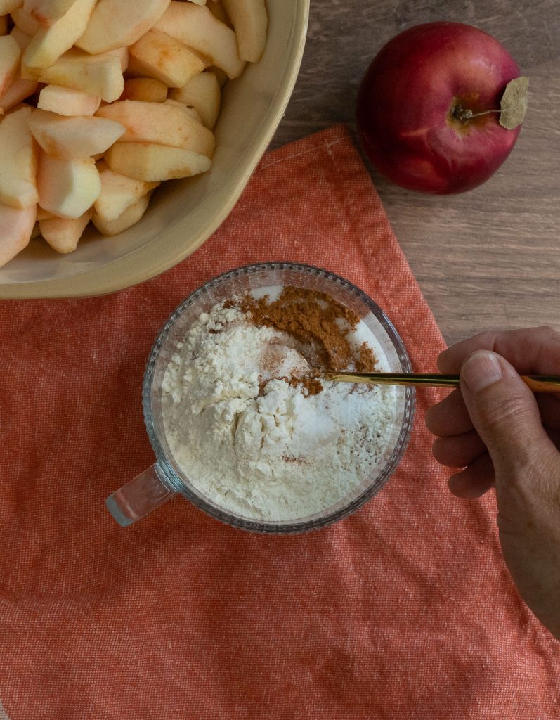 spices and flour being mixed together for the apple filling 