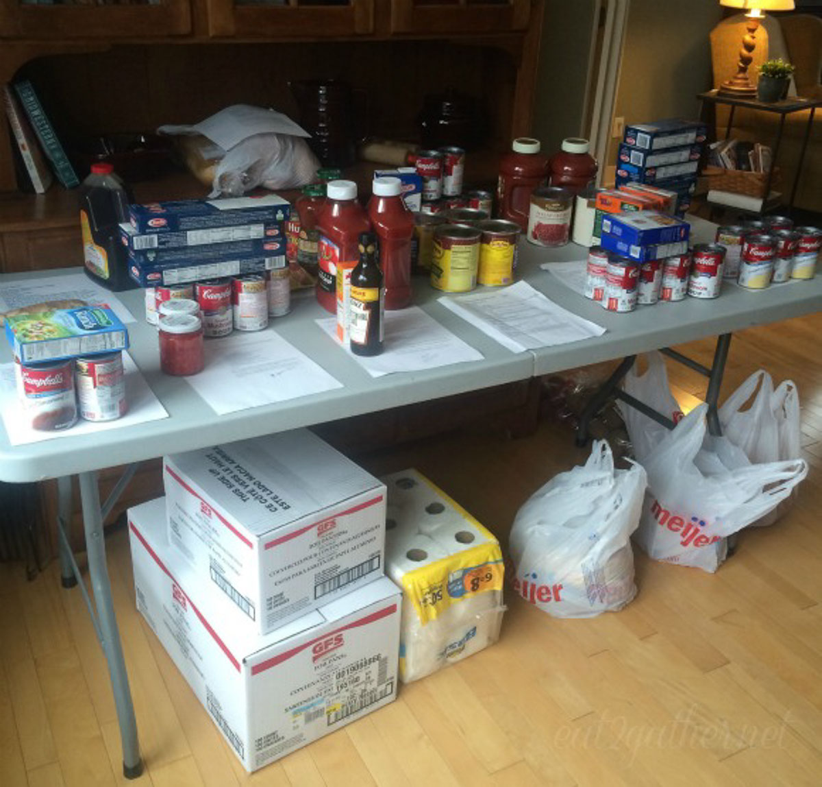 food lined up on a table showing the organization process of a freezer meal cooking day